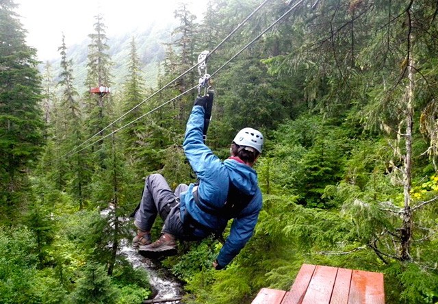 Photo of man on alpine zipline