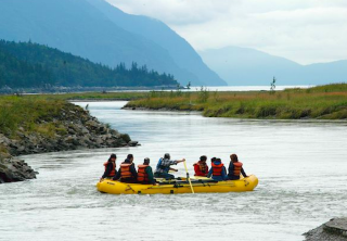 Photo of chilkoot trail hike float and summit drive floating down the gentle taiya river